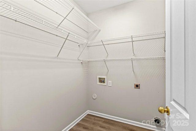 laundry room featuring hookup for a gas dryer, hookup for a washing machine, dark wood-type flooring, and hookup for an electric dryer