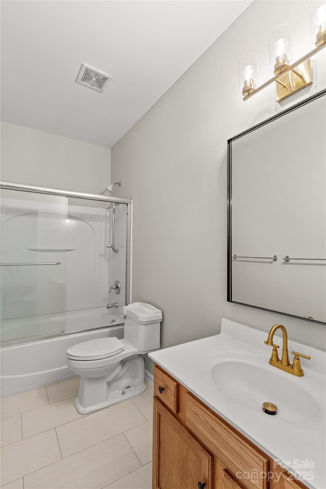 full bathroom with vanity, tile patterned floors, enclosed tub / shower combo, and toilet