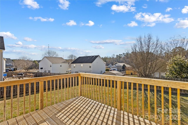 wooden terrace with a lawn