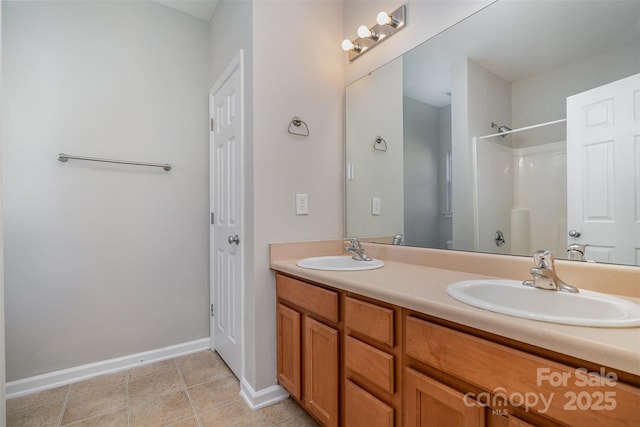 bathroom with walk in shower and vanity