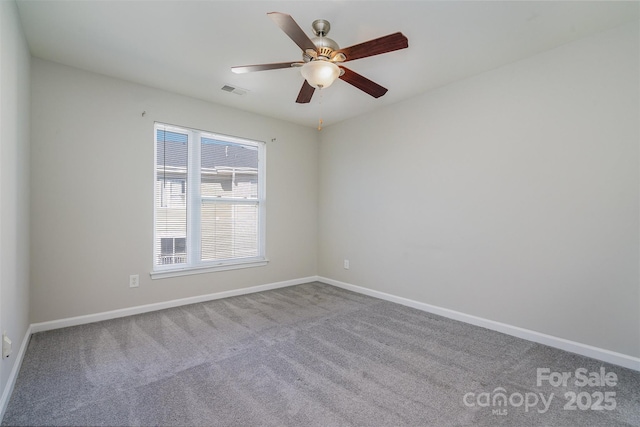 empty room with carpet and ceiling fan