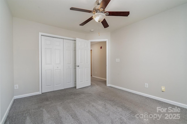 unfurnished bedroom featuring ceiling fan, a closet, and carpet floors