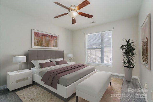 bedroom with ceiling fan and light colored carpet