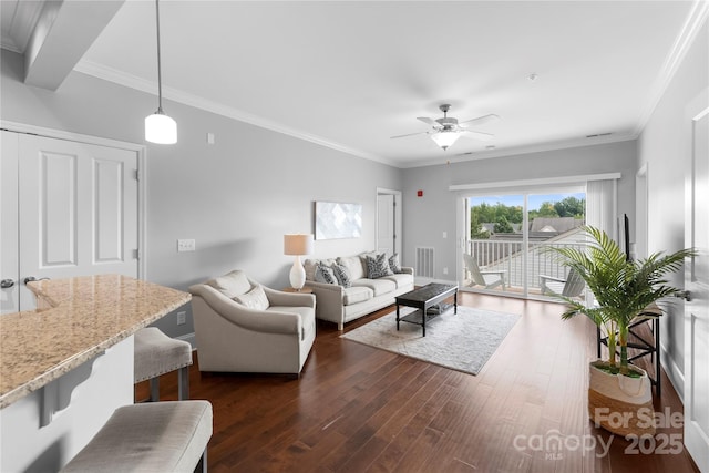 living room with crown molding, dark hardwood / wood-style floors, and ceiling fan