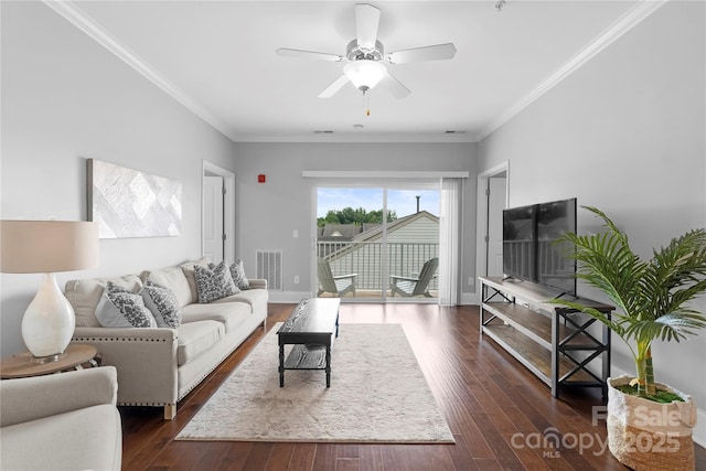 living room featuring ornamental molding, dark hardwood / wood-style floors, and ceiling fan