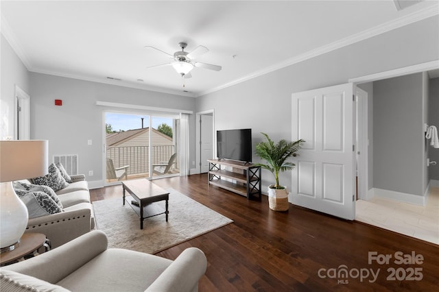 living room featuring ceiling fan, ornamental molding, and dark hardwood / wood-style floors