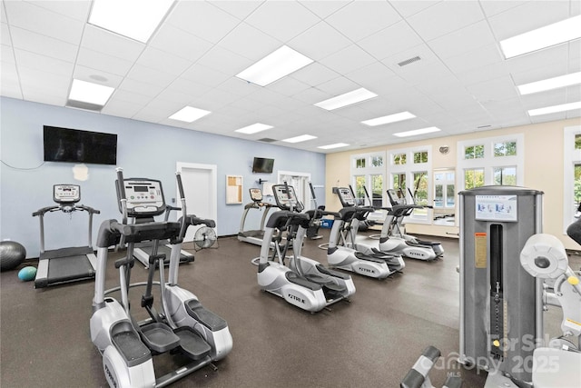 exercise room featuring a drop ceiling