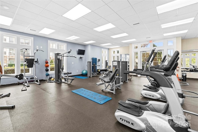 workout area featuring a drop ceiling