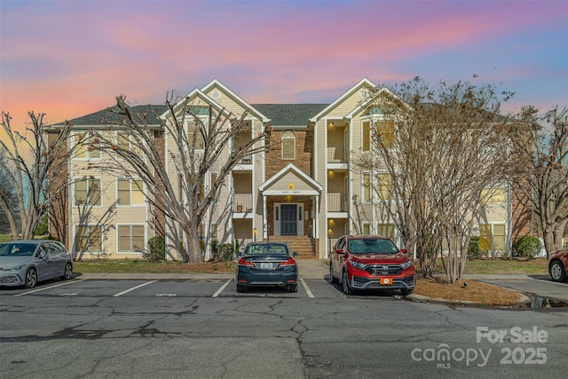 view of outdoor building at dusk