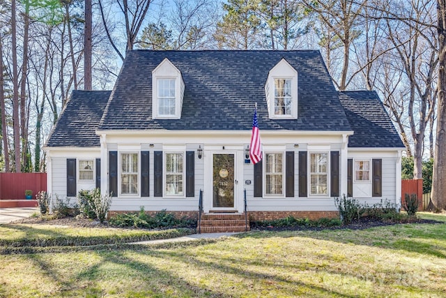 cape cod house featuring a front lawn