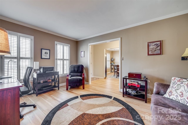 office space featuring crown molding and light hardwood / wood-style floors