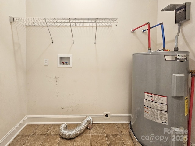 washroom with washer hookup, hookup for an electric dryer, and water heater