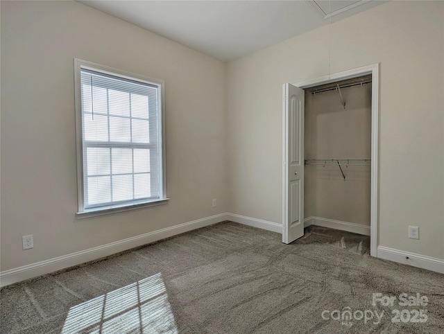 unfurnished bedroom featuring a closet and carpet