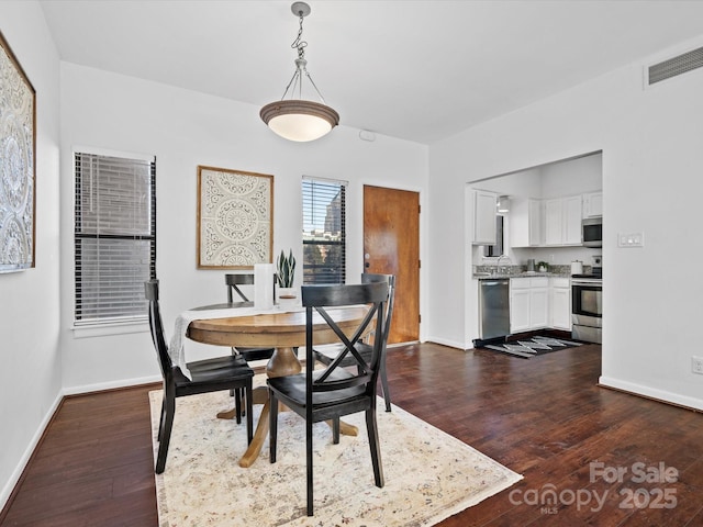 dining room featuring dark hardwood / wood-style floors