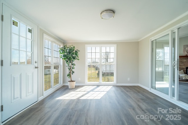 unfurnished sunroom featuring a wealth of natural light