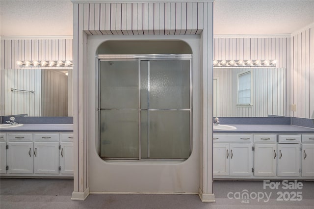 110 Robin Rd, Lincolnton, NC 28092 - bathroom with vanity, a textured ceiling, shower / bath combination with glass door, and crown molding