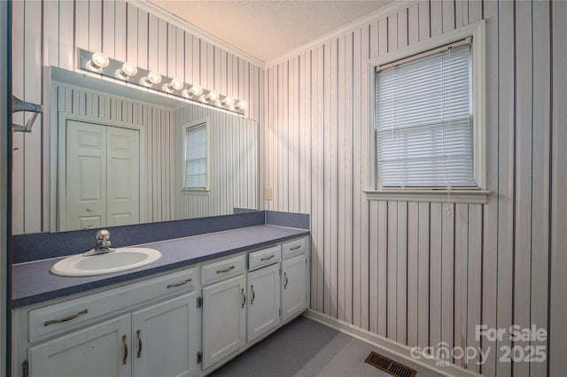 110 Robin Rd, Lincolnton, NC 28092 - bathroom with visible vents, a textured ceiling, crown molding, wallpapered walls, and vanity