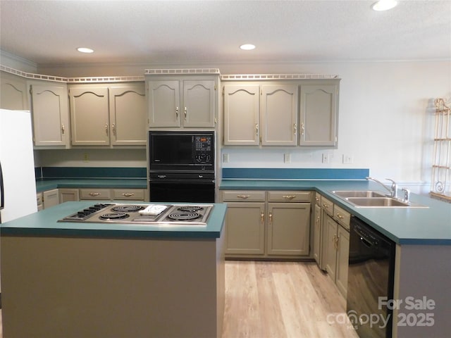 110 Robin Rd, Lincolnton, NC 28092 - kitchen with light wood-type flooring, black appliances, a sink, recessed lighting, and a peninsula