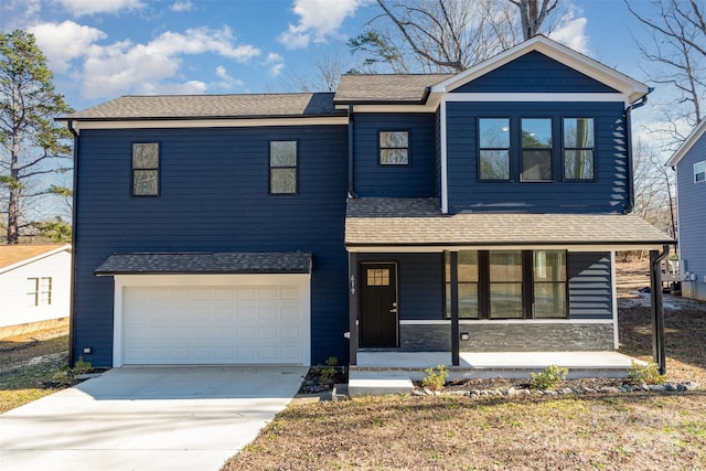 view of front of home featuring a porch and a garage