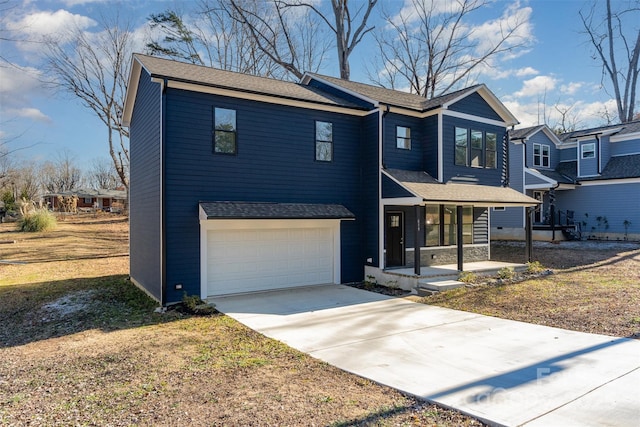 view of front of property featuring a front lawn, covered porch, and a garage