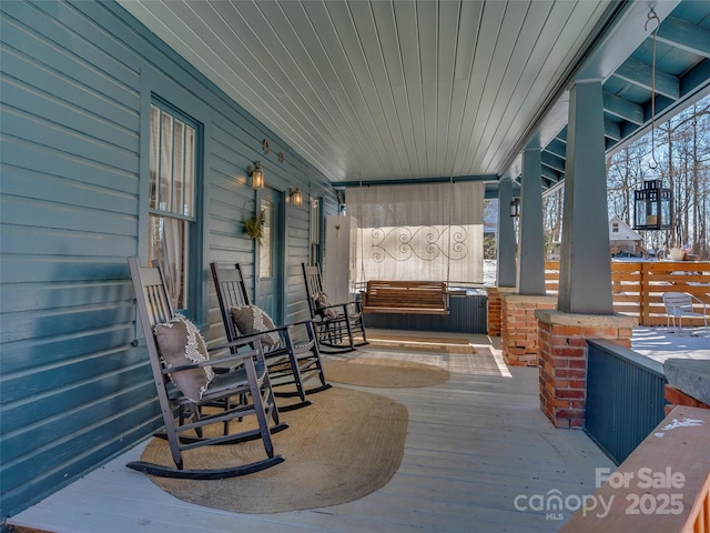 snow covered patio with covered porch