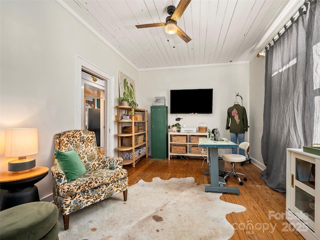 home office with ornamental molding, ceiling fan, hardwood / wood-style flooring, and wood ceiling