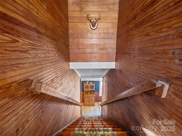 stairs with wood walls