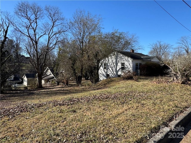 view of property exterior featuring a yard