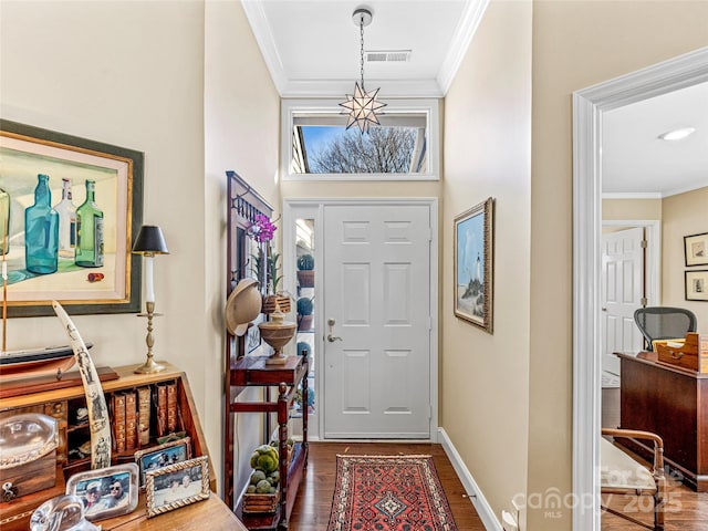 foyer entrance featuring dark hardwood / wood-style floors and crown molding