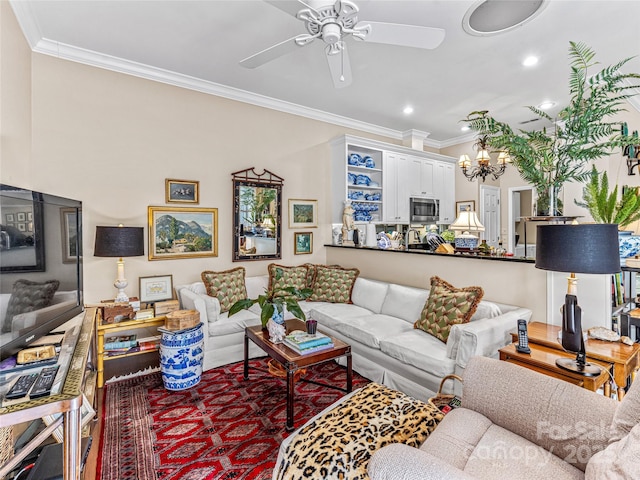 living room with ceiling fan and crown molding