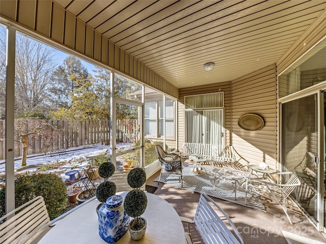 sunroom featuring wooden ceiling