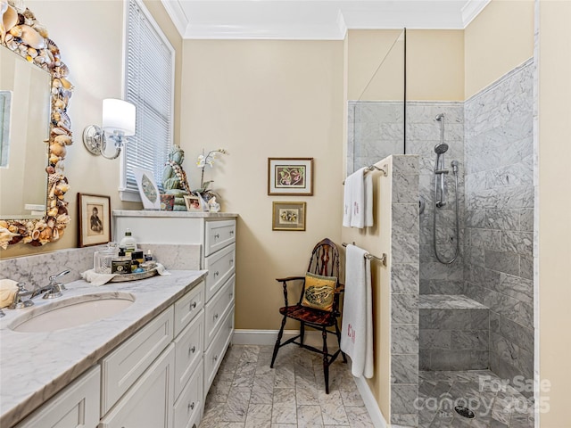 bathroom featuring crown molding, vanity, and a tile shower