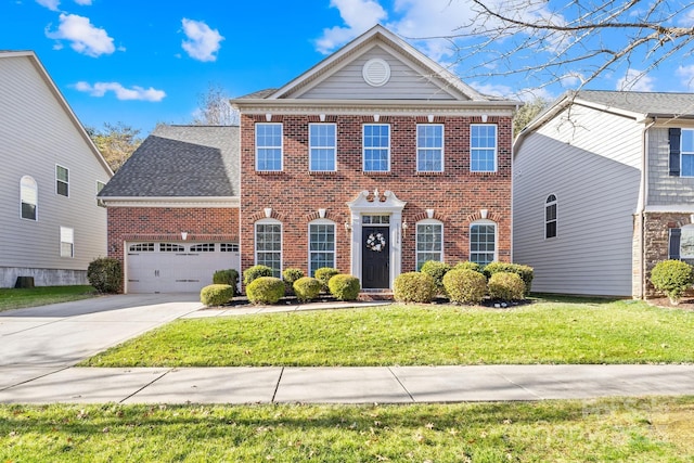 colonial inspired home featuring a front lawn