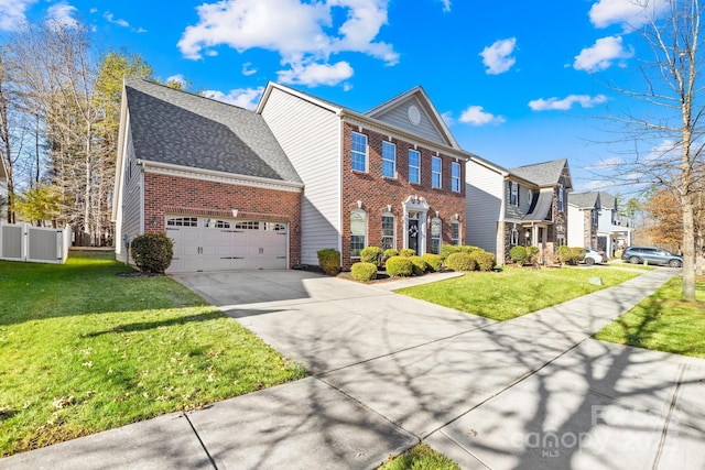 view of front of home featuring a garage and a front lawn