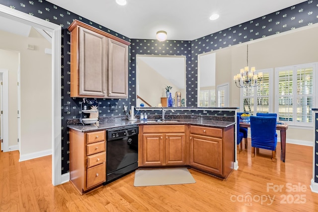 kitchen with sink, light hardwood / wood-style flooring, kitchen peninsula, and black dishwasher