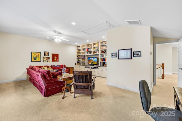 carpeted living room featuring ceiling fan, built in shelves, and vaulted ceiling