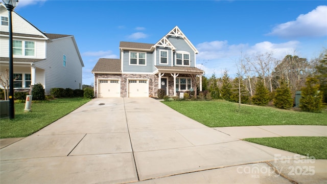 view of front of house with covered porch, a garage, and a front lawn