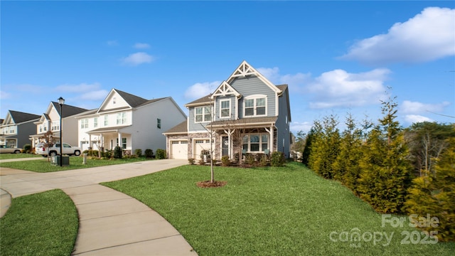 view of front of house with a front yard and a garage