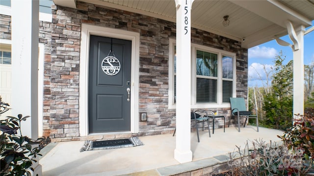 property entrance featuring covered porch