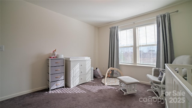 carpeted bedroom featuring a crib