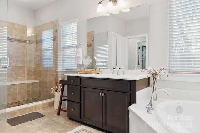 bathroom with a garden tub, tile patterned floors, a tile shower, and vanity