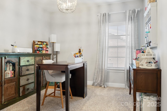 carpeted office with an inviting chandelier and baseboards