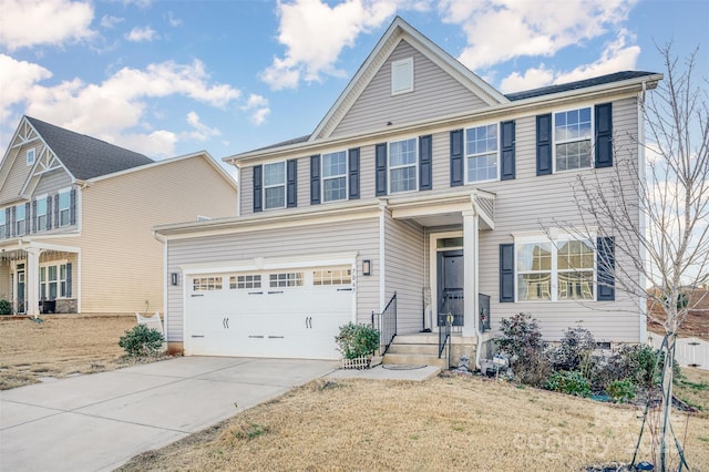 view of front of home with a garage and a front yard