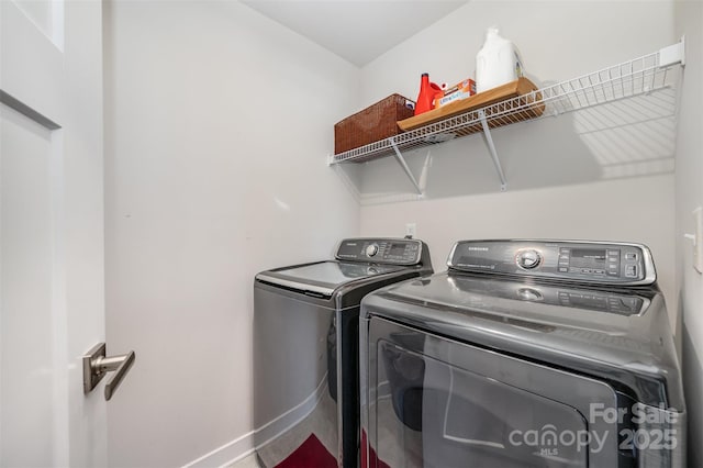 laundry area with independent washer and dryer