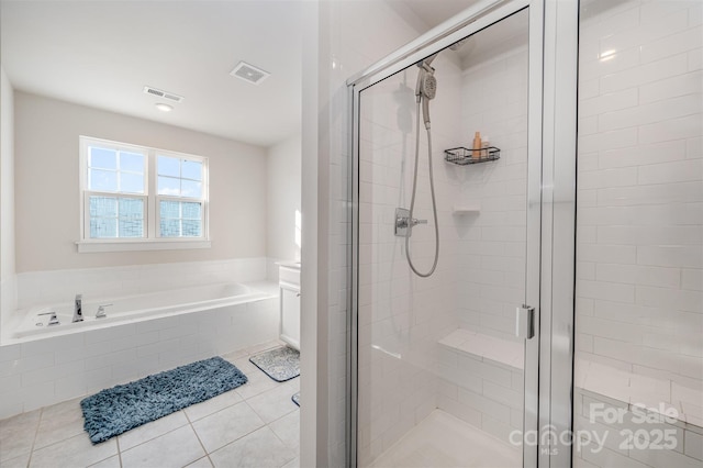 bathroom featuring shower with separate bathtub and tile patterned floors