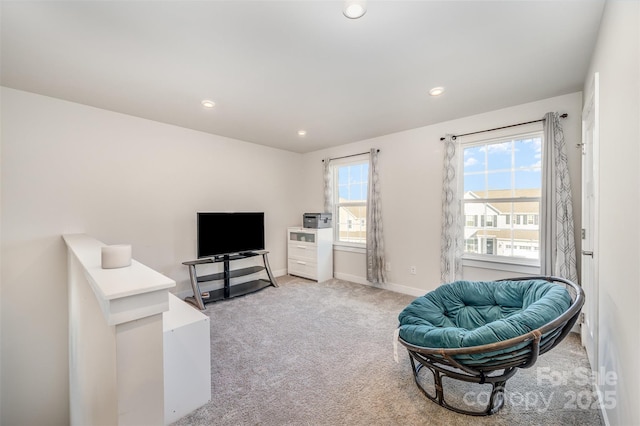 sitting room with light colored carpet