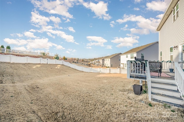 view of yard with a wooden deck