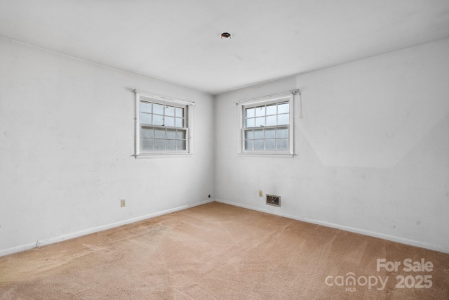 view of carpeted spare room