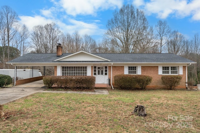 ranch-style house with a front yard and a carport