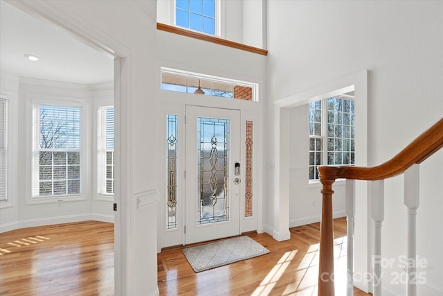 entrance foyer with light hardwood / wood-style flooring